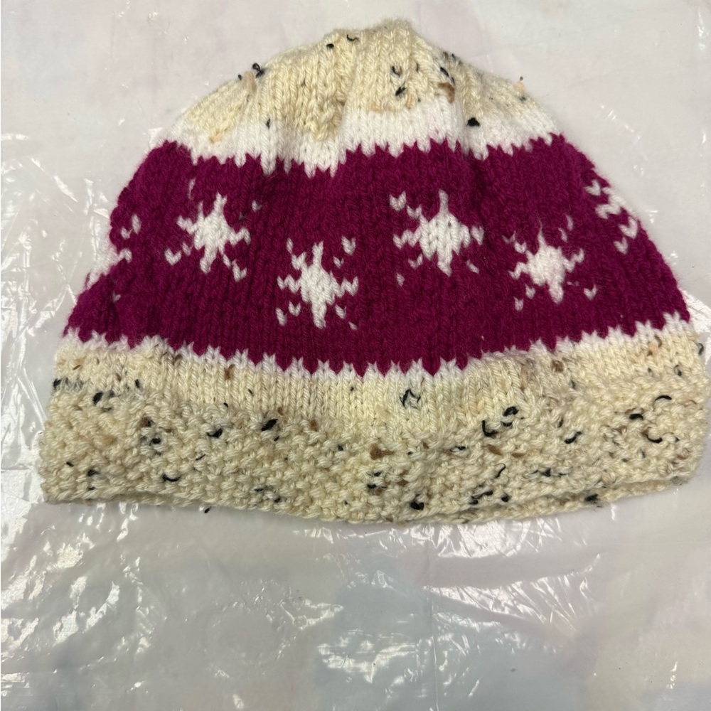 Home made by my mom. 
Kids' Knitted Beanie - Cream and Pink